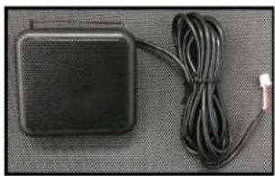 Black rectangular electronic device with attached cable and connector (no visible text or symbols)