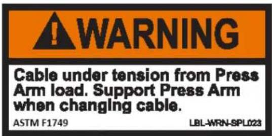 WARNING Cable under tension from Press Arm load. Support Press Arm when changing cable. ASTM F1749 LBL-WRN-SPL023