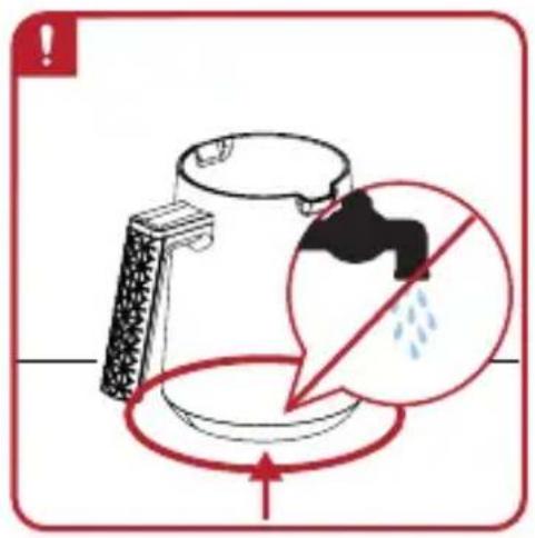 Safety warning illustration showing a hand holding a water droplet inside a mug, with a red circle indicating no water droplets.