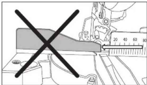 Technical diagram showing a tool with a crossed-out section and a ruler measuring a quantity, indicating measurement or inspection.