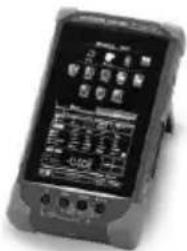 Scanned image of an electronic device displaying a digital display with labeled buttons and a small screen showing text.