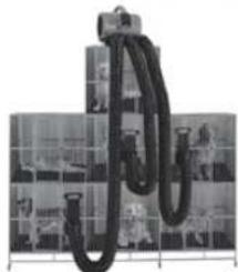 Close-up of a black corrugated cable or hose installed on a grid-patterned surface (no text or symbols visible)