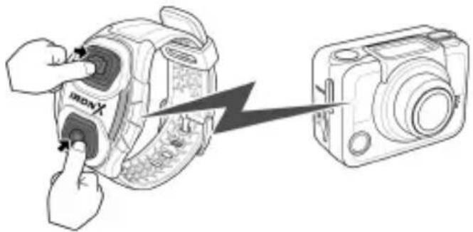 Diagram showing a hand inserting a device into a digital camera, with a lightning bolt indicating the process.
