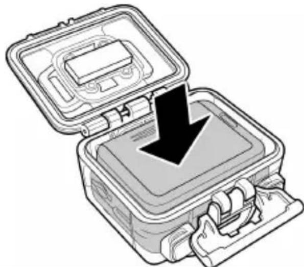 Illustration of a closed mechanical device with an open lid and a black downward arrow indicating a drop or removal (no text or symbols present)