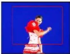 Athlete in red jersey performing a martial arts stance against blue background (no text or symbols visible)