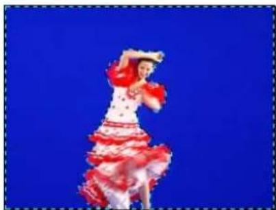 Person in red and white polka-dot costume dancing against a solid blue background (no text or symbols visible)