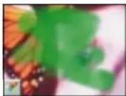Abstract green and orange brushstroke pattern (no text or symbols)