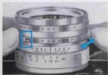 Close-up of a mechanical component with visible measurement markings and a blue indicator box highlighting a specific part.