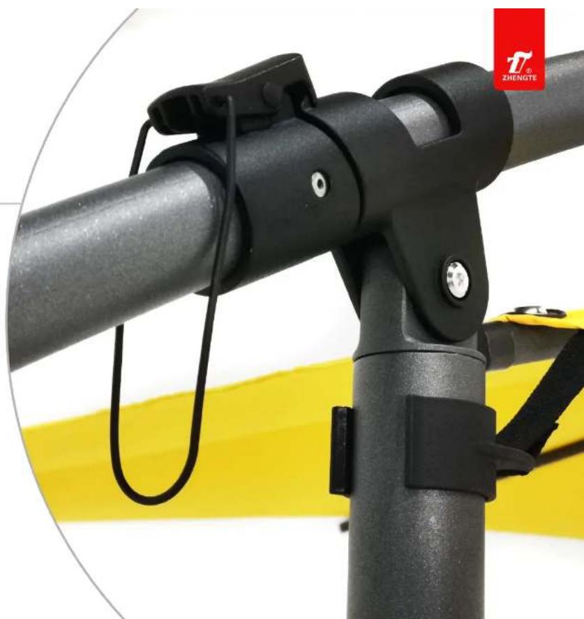 Close-up of a black mechanical lever assembly with yellow background (no text or symbols visible)