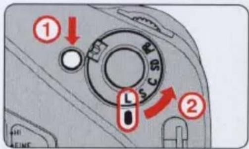 Diagram of a camera mode dial with numbered labels and directional arrows indicating rotation or adjustment.