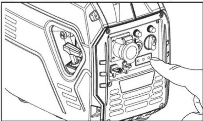 Line drawing of a device rear panel with a hand pointing to the component (no text or symbols visible)
