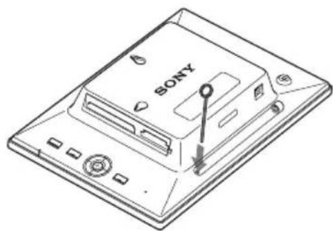 Line drawing of a Sony computer monitor with a key inserted, showing no text or symbols on the device itself.