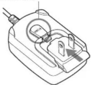 Technical line drawing of a plug socket with a bulb and screwdriver (no text or symbols).