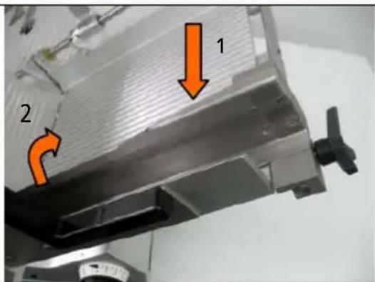 Technical diagram showing a mechanical component with labeled parts and directional arrows indicating flow or movement.