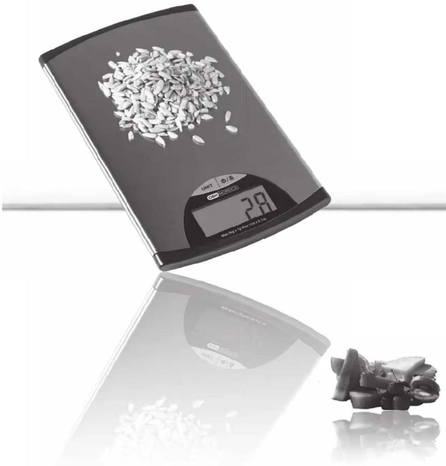Digital kitchen digital scale with rice grains on top and processed food items below (no visible text or symbols)