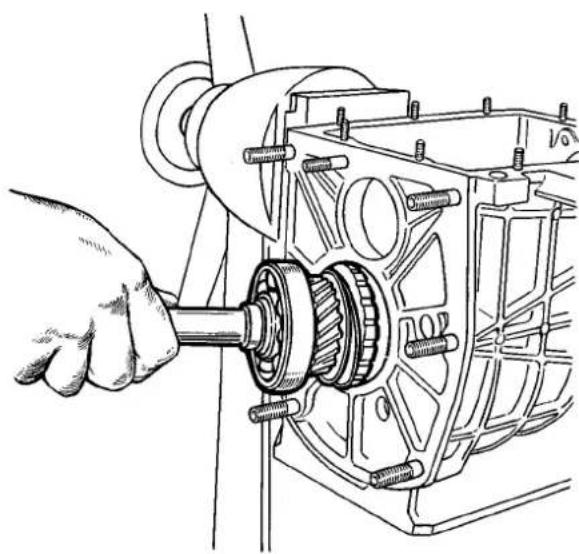 Technical line drawing of a hand operating a mechanical gear assembly (no text or symbols present)