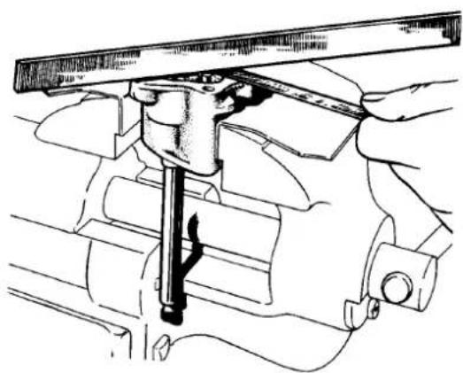 Technical line drawing of a mechanical assembly with a tool inserted into a housing (no text or symbols present)