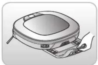 Illustration of a hand holding a vacuum cleaner next to a device with a lid (no text or symbols visible)