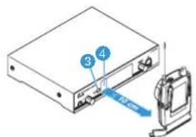 Diagram showing a device with labeled components and a blue arrow pointing to a component, likely indicating a process or assembly.