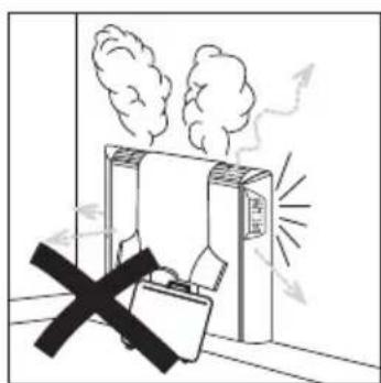 Safety warning illustration showing a device emitting smoke with a cross symbol indicating no hazard.