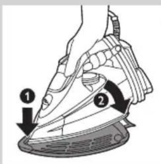 Diagram of a hand iron with labeled parts, showing iron being heated and moving down the cup.