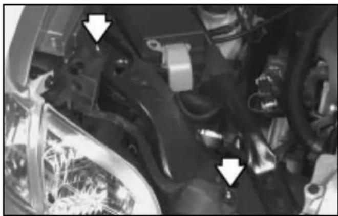 Close-up of mechanical components with white arrows pointing to features (no visible text or symbols)