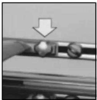 Close-up of a hand pressing down on a roller with a downward arrow indicating compression (no text or symbols)