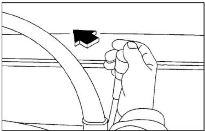 Line drawing of a hand holding a cable with a black arrow pointing to it, against a grid background (no text or symbols)