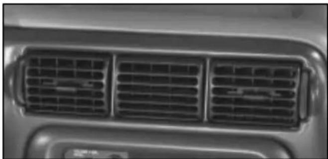 Close-up of a car's front grille with three grilles (no text or symbols visible)