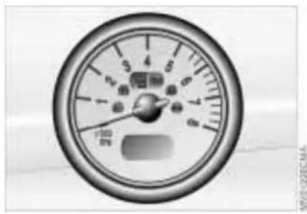 Close-up of a circular gauge or dial with measurement markings and a small object at the center (no readable text or symbols)