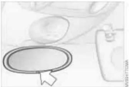 Illustration of a hand holding a computer mouse with an oval button, next to a small device (no text or symbols visible)