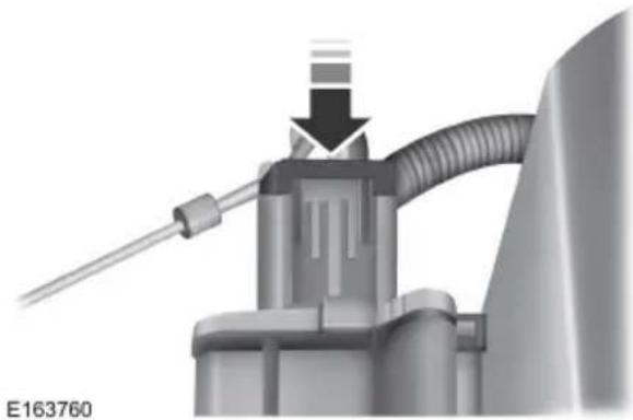 Mechanical component diagram showing a pipe with a downward arrow, no visible text or symbols