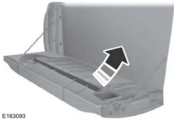 3D rendering of a mechanical component with an arrow pointing to a slot, no visible text or symbols