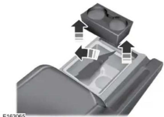 Close-up of a mechanical component with arrows indicating movement or assembly (no text or symbols visible)