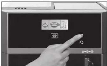Hand pressing a button on a kitchen appliance control panel with icons for food preparation and lighting
