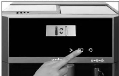 Close-up of a hand pressing a button on a device with Chinese control labels and a 'OK' button