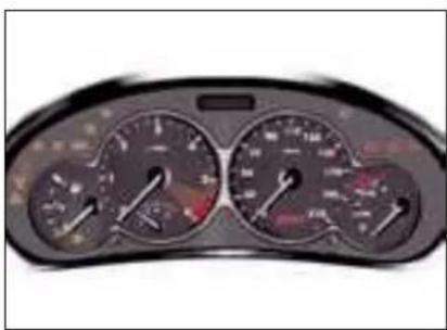 Close-up of a car dashboard with multiple gauges and dials (no visible text or symbols)