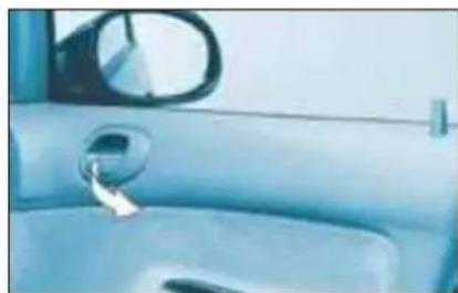 Interior view of a car showing the dashboard and side mirror (no text or symbols visible)