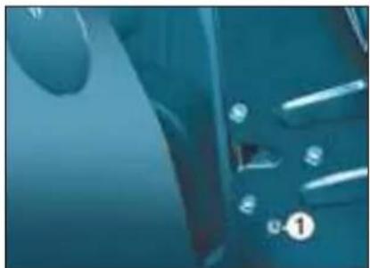 Close-up of a blue car interior with visible buttons and sensors (no text or symbols)