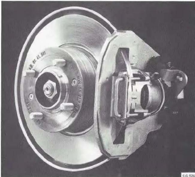 Close-up of a car brake assembly with visible caliper and housing (no text or symbols)