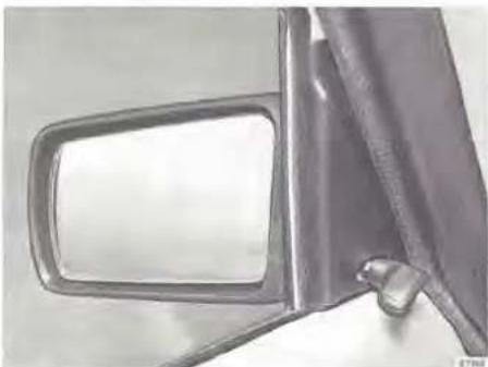 Close-up of a car front mirror and side arm, showing no text or symbols