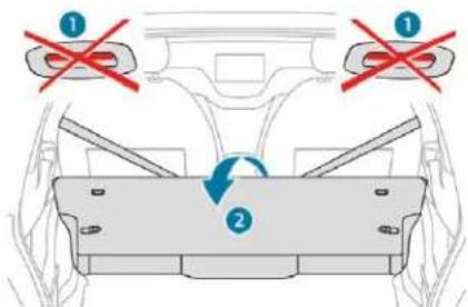 Diagram showing vehicle rearview and side view with red prohibition signs and a blue circular arrow indicating rotation or movement.