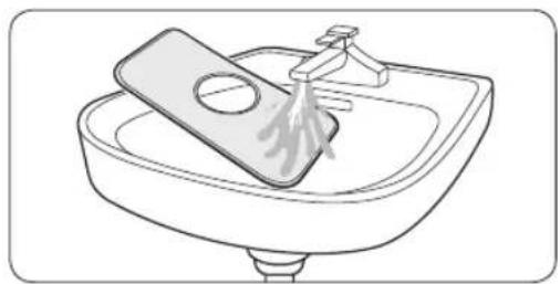 Line drawing of a sink with a plate and faucet, no text or symbols present
