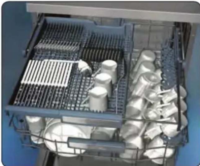 Interior view of a multi-level kitchen appliance with metal grilles and packaged goods (no visible text or labels)