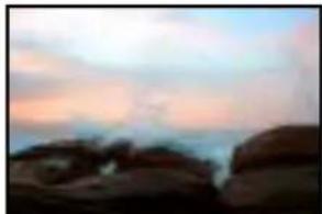 Silhouette of rocky outcrops against a twilight sky (no text or symbols visible)