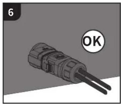 Close-up of a mechanical connector with two leads, labeled 'OK' (no text or symbols on the component itself)