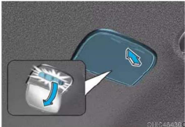 Diagram showing a blue button with a blue arrow pointing to it, with an inset highlighting a blue curved arrow pointing downward.