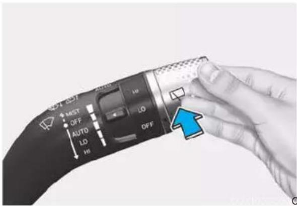 Close-up of a hand interacting with a device's screen, showing control buttons like MAX, OFF, LO, and HI.