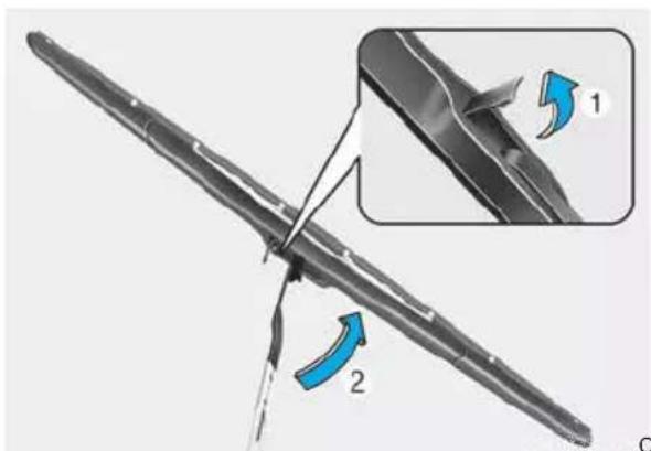 Technical diagram showing a mechanical component with labeled parts and directional arrows indicating motion or force.