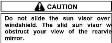 CAUTION Do not slide the sun visor over windshield. The slid sun visor w obstruct your view of the rearvie mirror.